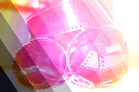  photographic negative film rolling up in spirals forms patternsの写真素材