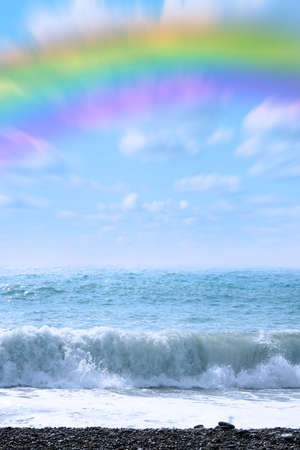 abstract rainbow on beautiful sea beach and waveの写真素材