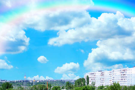 rainbow on sky on high-rise vein houseの写真素材