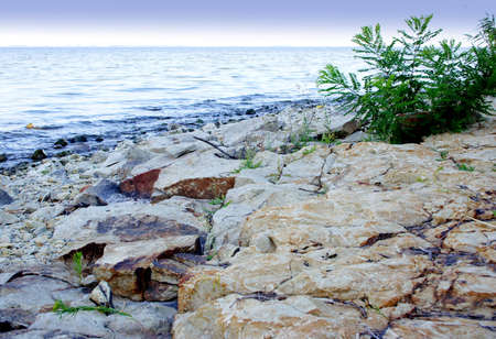 seascape with beach on background blue sky and cloudの写真素材