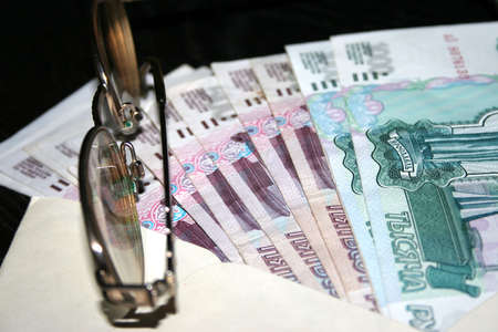 clean envelope,paper bills and spectacles for correcting the visionの写真素材