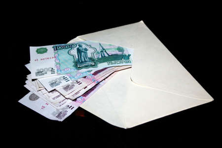 several paper money bills in white clean envelopeの写真素材