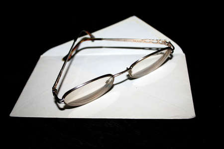 clean envelope and spectacles for correcting the visionの写真素材