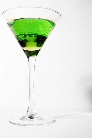 abstract scene with drink green colour in glass liquor-glassの写真素材