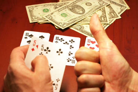 playing cards in hand of the player in poker
