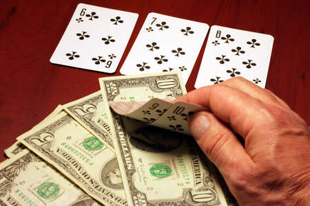 playing cards in hand of the player in poker