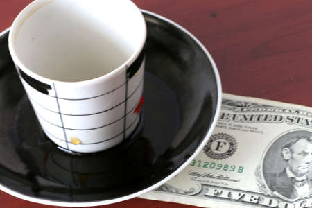 payment by cash for cup of the hot drinkの写真素材