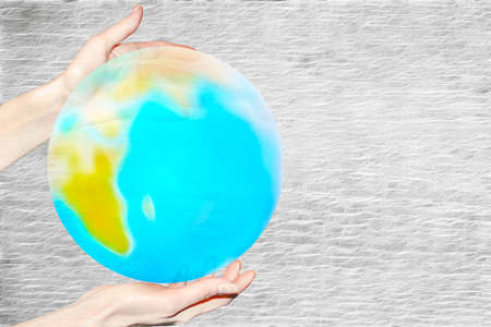 abstract scene of the planet in feminine handの写真素材