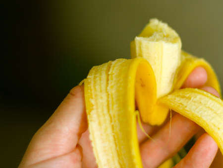 banana in hand of the personの写真素材