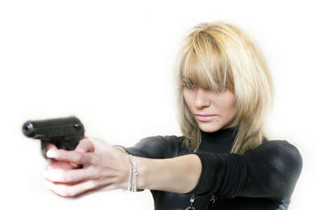 beautiful girl with pistol at hand の写真素材