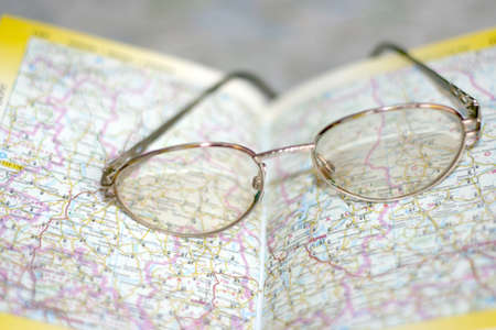 spectacles on page geographical atlasの写真素材