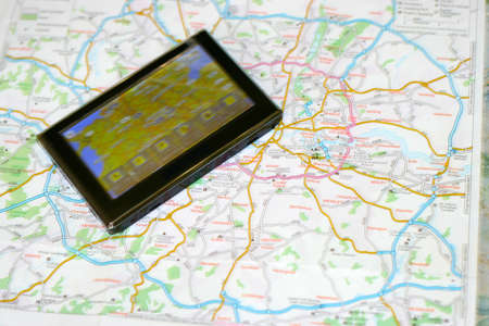 gps navigator on the map as background travelの写真素材