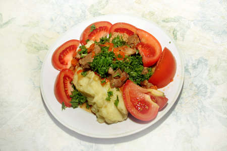 steak with fresh vegetables and herbsの写真素材