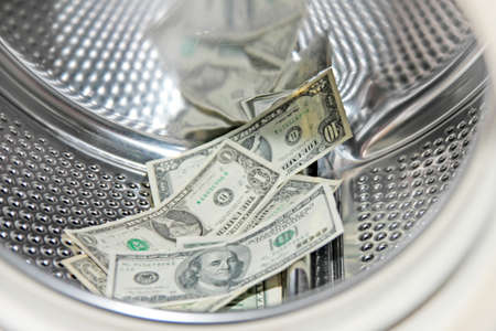 american dollars in the drum washing machineの写真素材