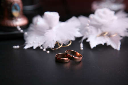 abstract scene with wedding rings and floral background 