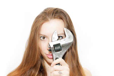 beautiful girl keeps in the hands wrench の写真素材