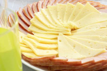 slices cheese and piece brisket as part festive menuの写真素材