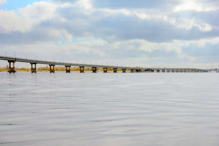 glow sky and open-work bridge on the riverの写真素材