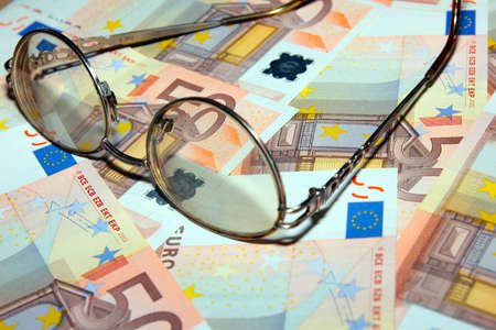 certain amount bill europe euro and old spectaclesの写真素材