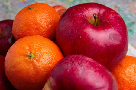 fresh ripe tangerine and apple as symbol harvestの写真素材