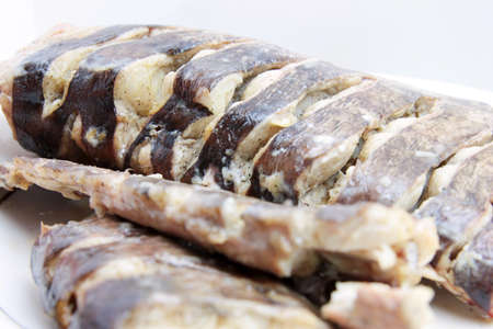 piece fresh roasted fish sheatfish on plateの写真素材