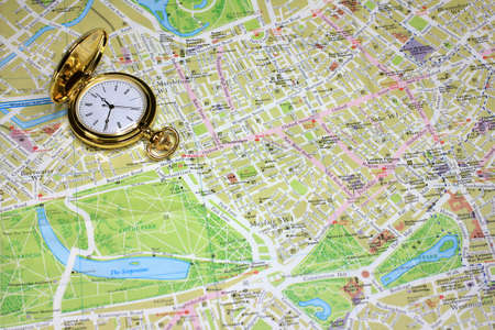 exact watch and geographical map as element choice directions journeyの写真素材