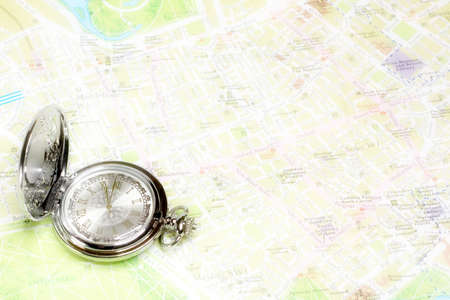 exact watch and geographical map as element choice directions journeyの写真素材