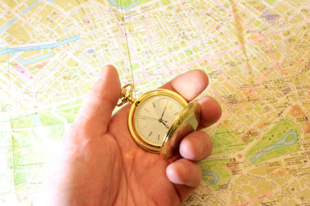 exact watch and geographical map as element choice directions journeyの写真素材