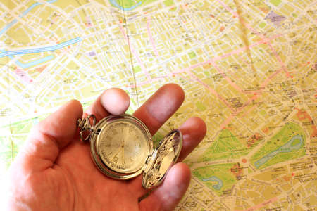 exact watch and geographical map as element choice directions journeyの写真素材