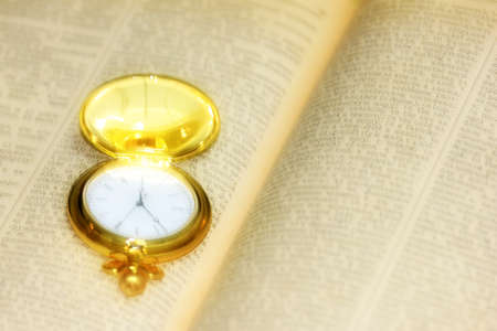 old watch and page book as element reception knowledgesの写真素材