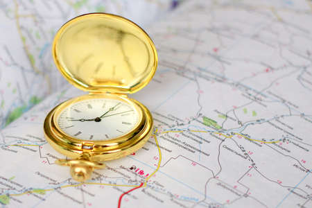 choice of route with the use old clock and geographical mapの写真素材