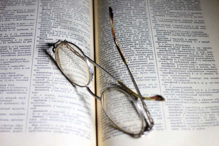 old book and glasses for the correction of sightの写真素材