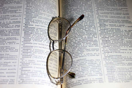 old book and glasses for the correction of sightの写真素材