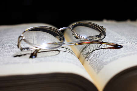old book and glasses for the correction of sightの写真素材