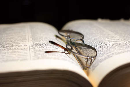 old book and glasses for the correction of sightの写真素材
