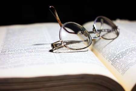 old book and glasses for the correction of sightの写真素材