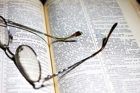 old book and glasses for the correction of sightの写真素材