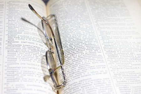 old book and glasses for the correction of sightの写真素材