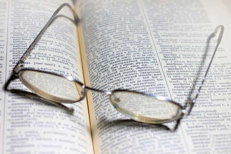 old book and glasses for the correction of sightの写真素材
