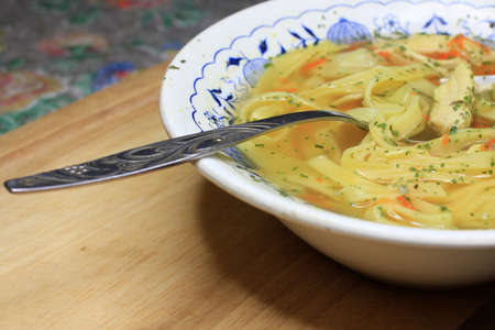 delicious chicken soup with noodle as element dinnerの写真素材