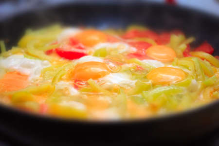 quick morning meal with roasted egg and fresh vegetablesの写真素材