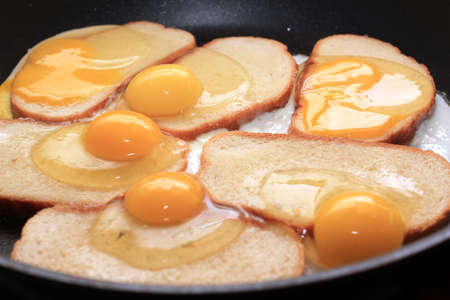 fried eggs and fried bread as part morning foodの写真素材