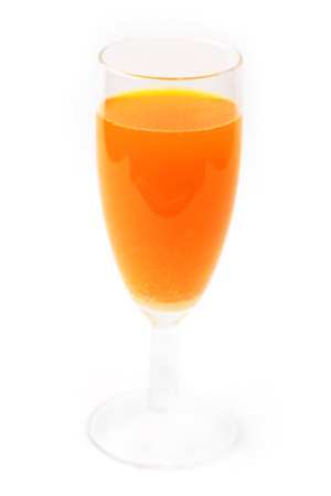 bright orange drink in liquor-glass as element of the settingの写真素材