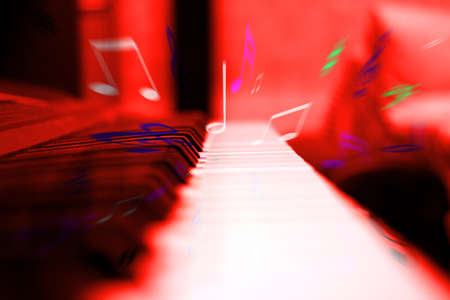 dark and white keys of a piano as background musicの写真素材