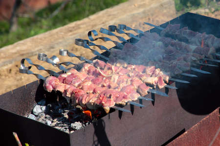 juicy pieces of meat on the grillの写真素材