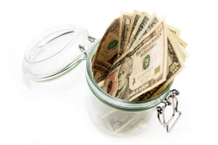 abstract image storage dollars in a glass jar