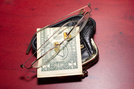 abstract purse, glasses for a correction sight and paper note dollarの写真素材