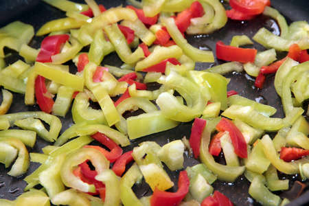colorful pieces of fresh bell peppers for cooking foodの写真素材