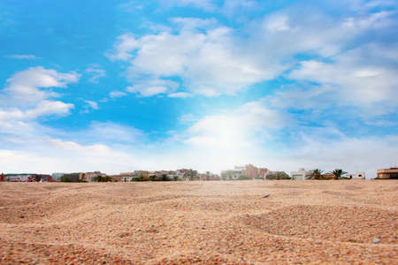 Surface of the sea beach with a pile of sand and skyの写真素材