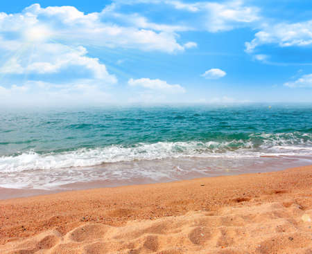 Sandy beach and the waves of the Mediterranean Seaの写真素材
